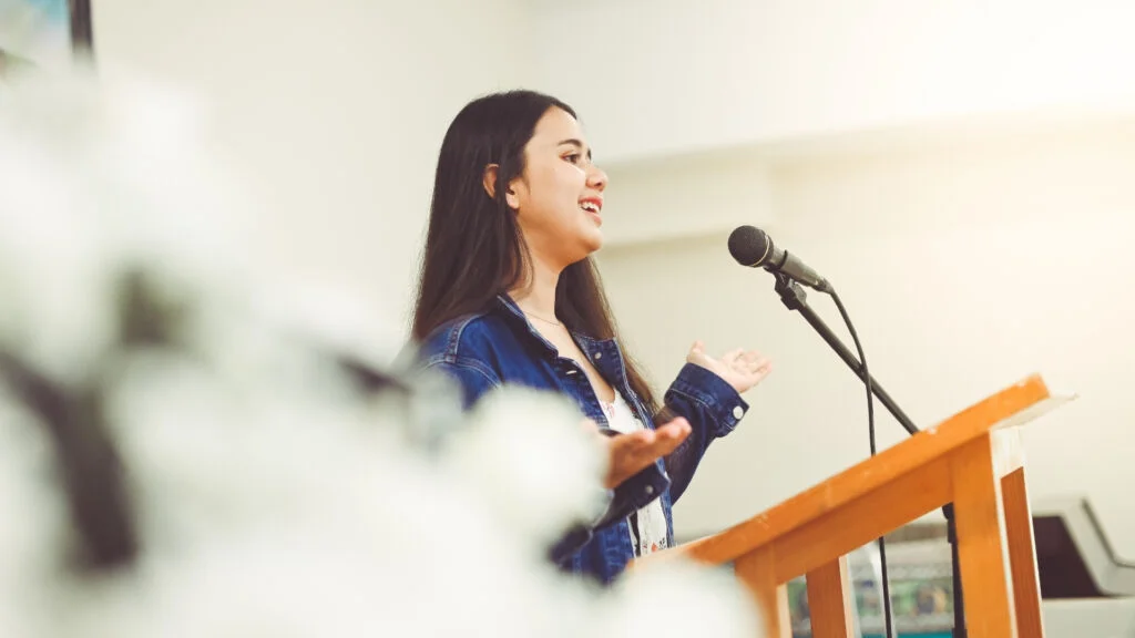Teens practicing public speaking in a small group session